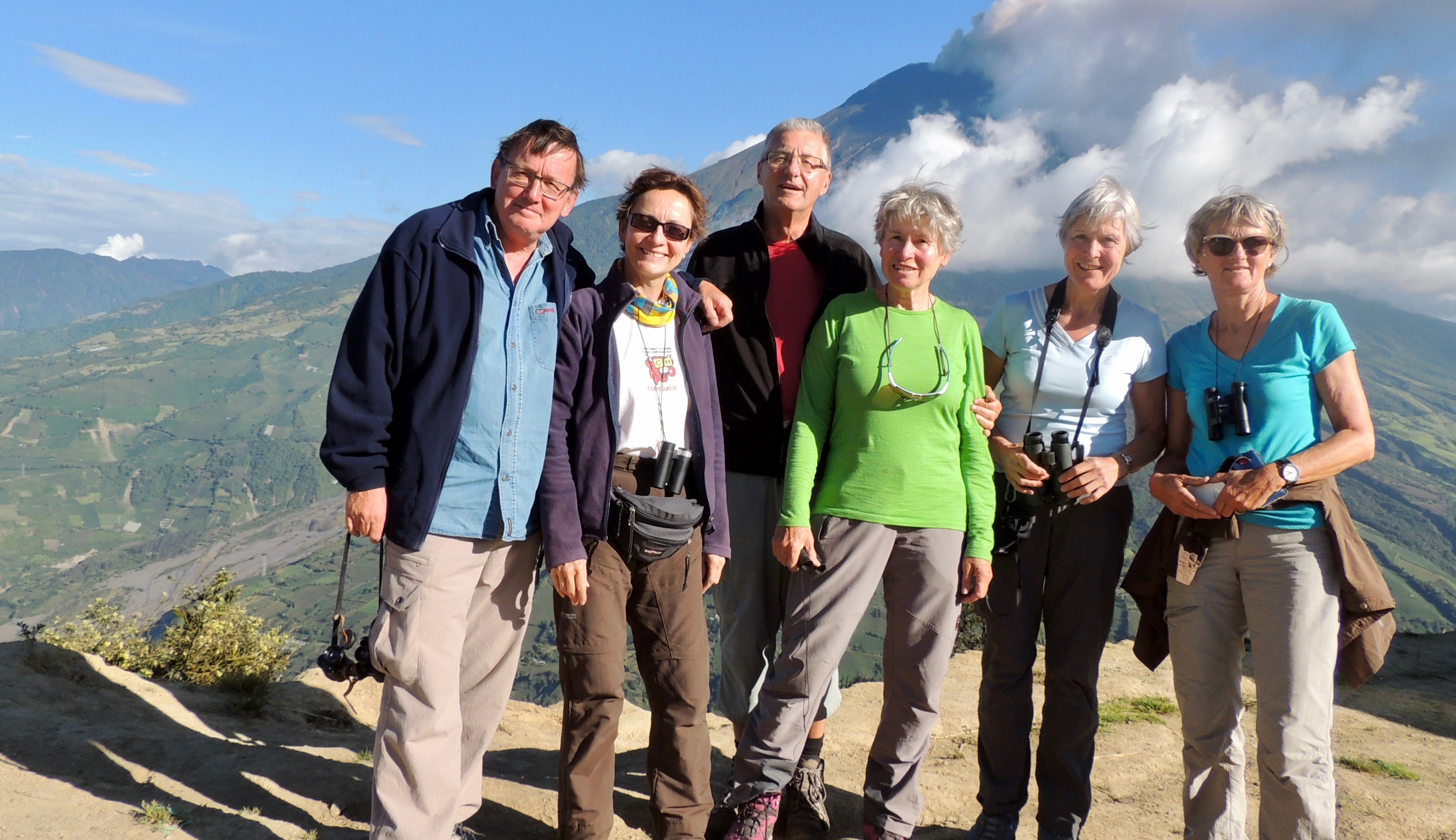 Six hikers in Ecuador in front of erupting Tungurahua Volcano