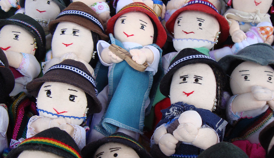 Fabric dolls in traditional Andean dress and hats on sale in Otavalo Market, Ecuador